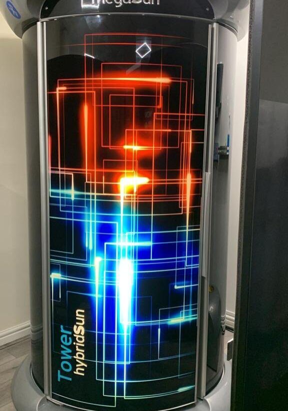 A refrigerator with an image of neon lights on it.